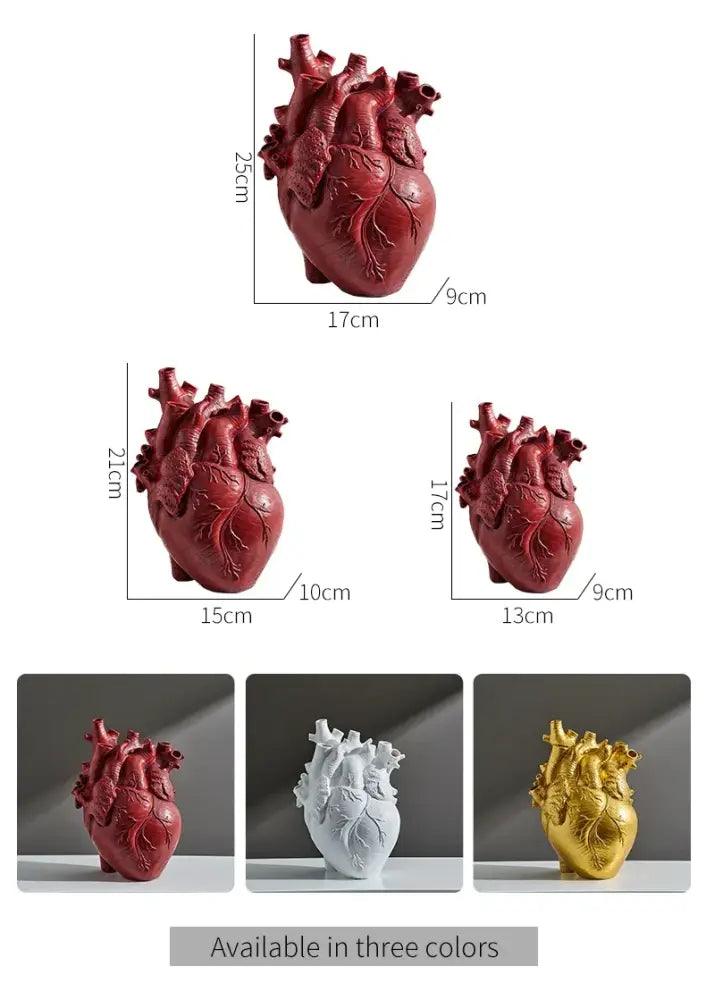 White anatomical heart vase with branches for living room decor