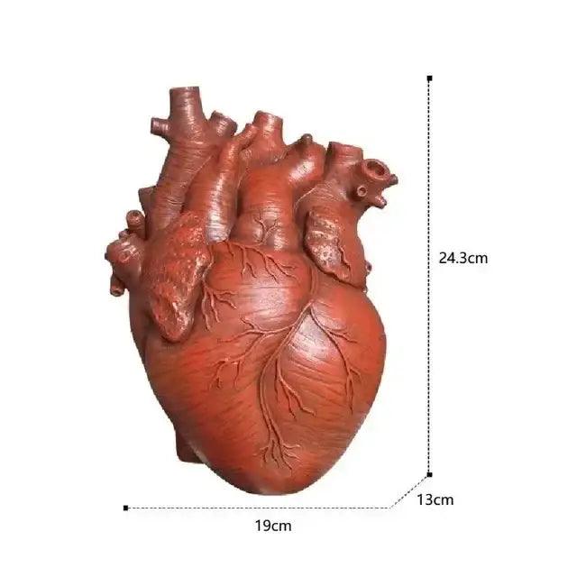 White anatomical heart vase with branches for living room decor