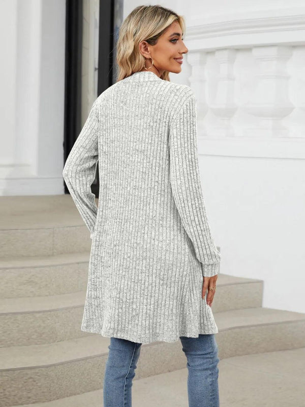 Autumn and winter long color long sleeved loose pocket cardigan jacket for women