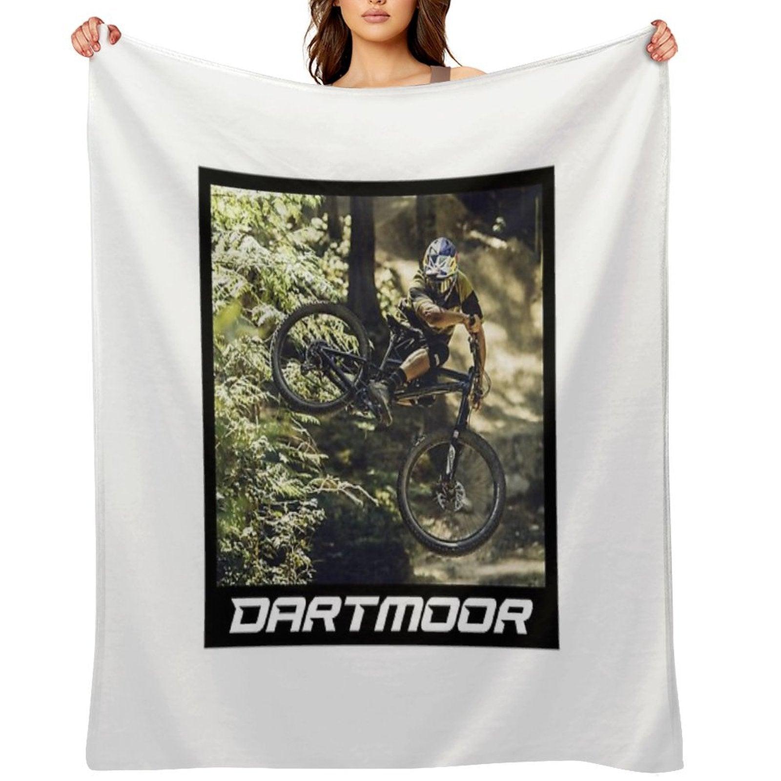 Cyclist Jumping with His Dartmoor Bikes Throw Blanket