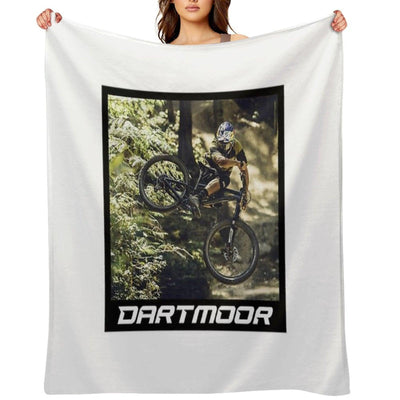Cyclist Jumping with His Dartmoor Bikes Throw Blanket