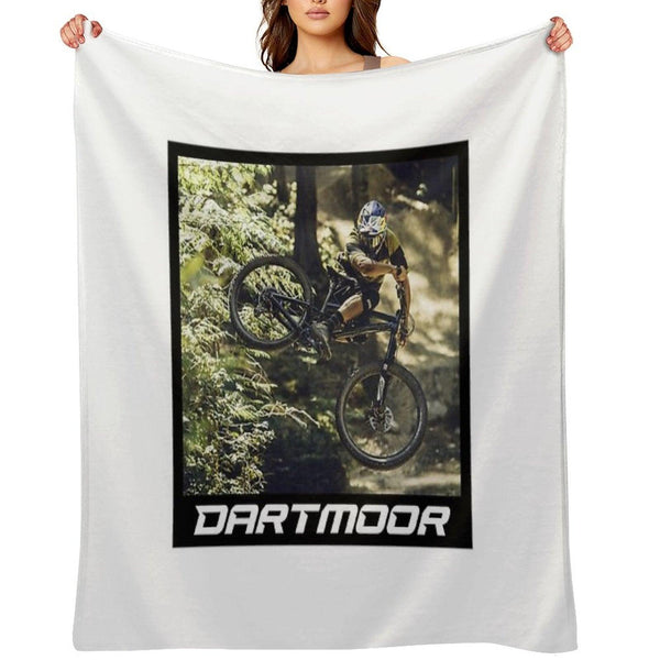 Cyclist Jumping with His Dartmoor Bikes Throw Blanket