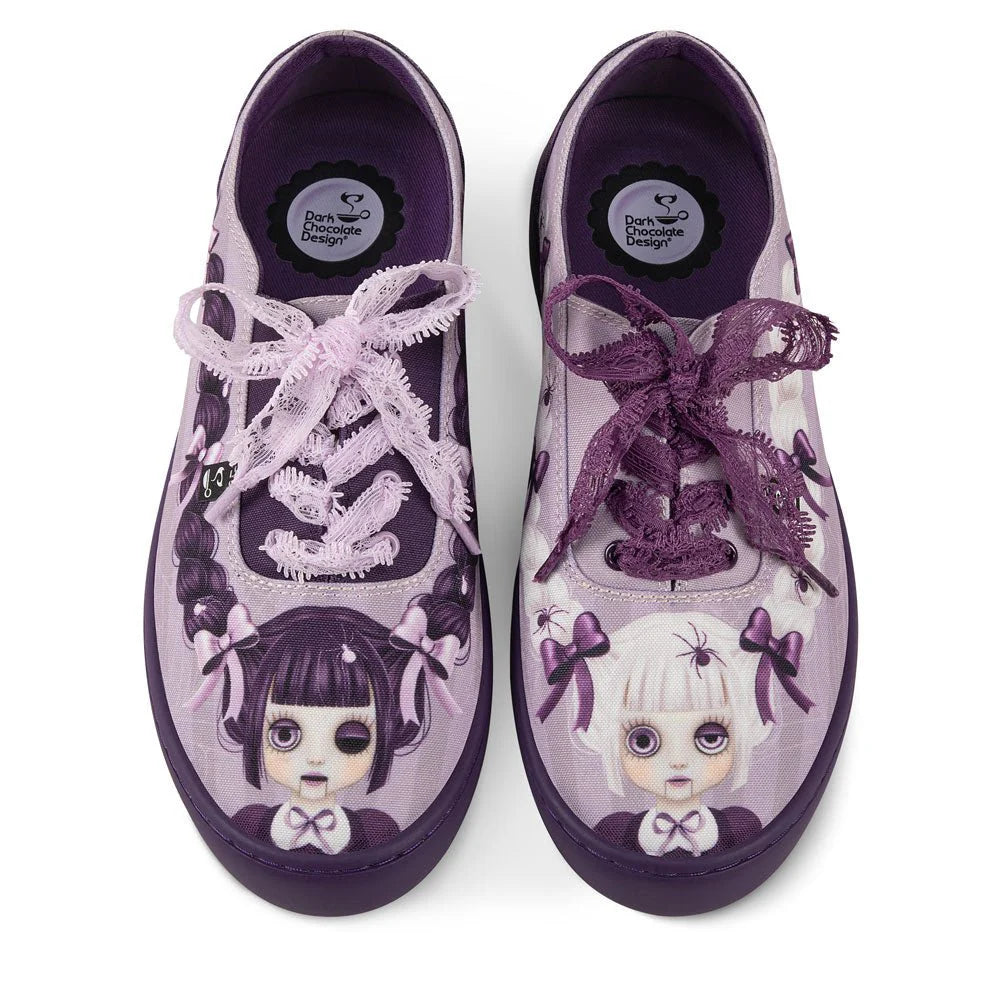Pair of purple and white sneakers with character designs on a white background