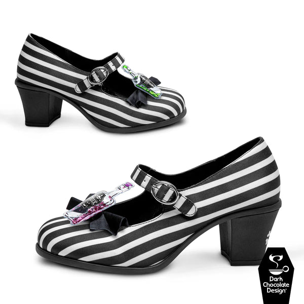 Black and white striped shoes with decorative buckles on a white background