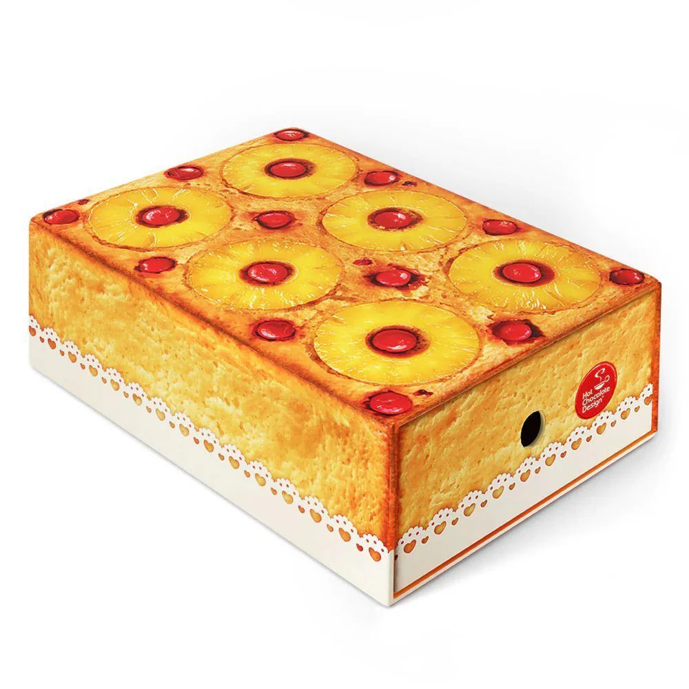 Chocolaticas Pineapple  Box upside-down cake-shaped box on a white background
