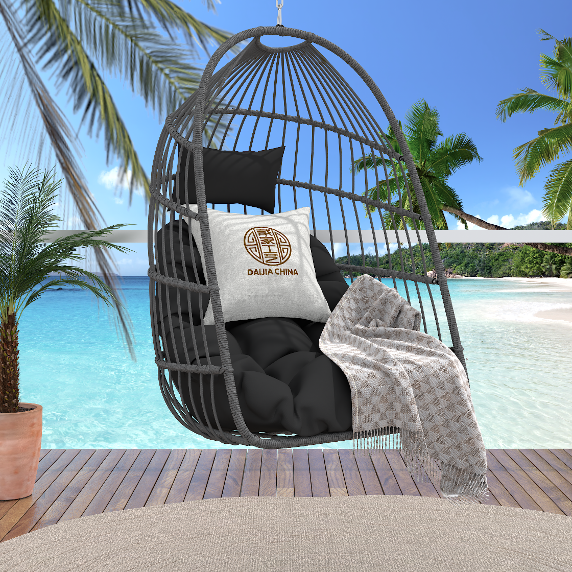 Egg-shaped wicker chair with black cushions and a white pillow featuring a logo, set against a tropical beach backdrop.