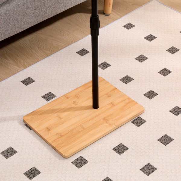 Sturdy bamboo base of the height adjustable side table for sofa. Provides stable support for the tray table structure.