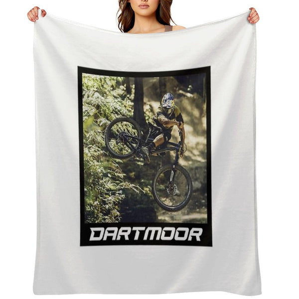 Cyclist Jumping with His Dartmoor Bikes Throw Blanket