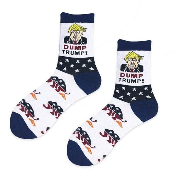 Pair of socks with a graphic of a person with text 'Dump Trump' and an American flag design on a white background.