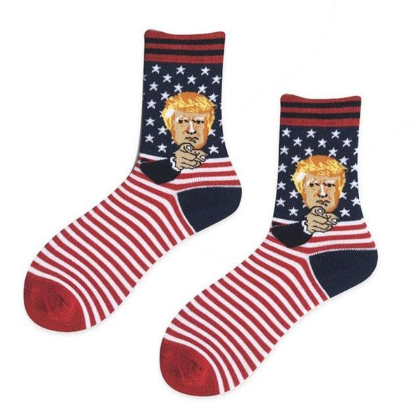 Pair of socks with a face design on an American flag background