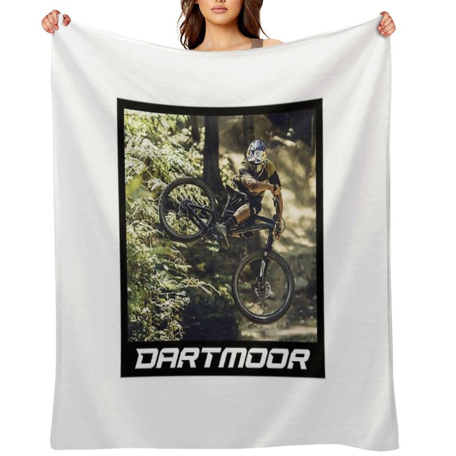 Cyclist Jumping with His Dartmoor Bikes Throw Blanket