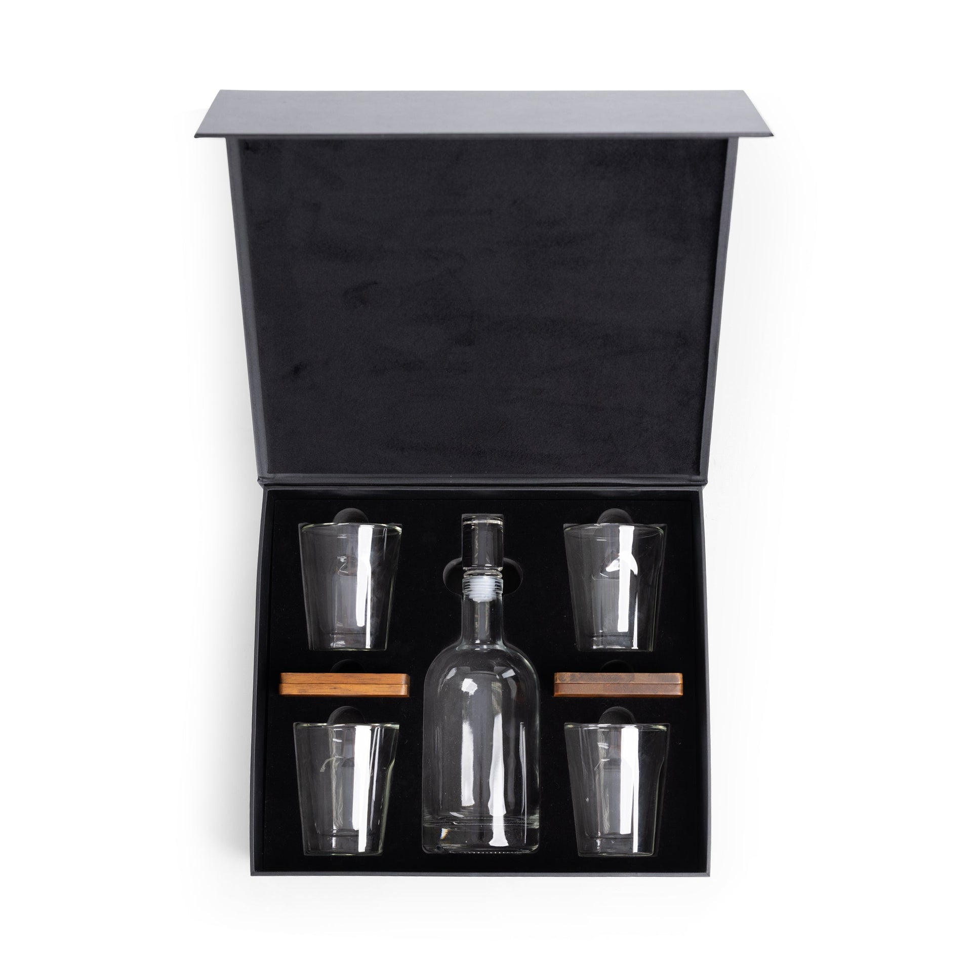Alcohol decanter set with glasses in a black box on a white background