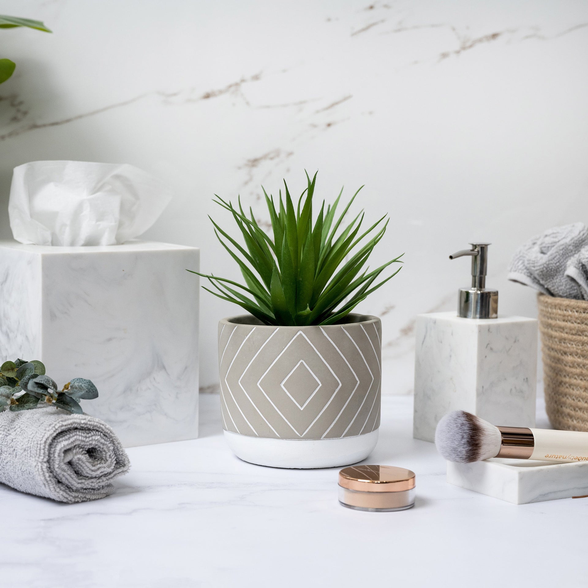 Artificial succulent plant in geometric patterned concrete pot 8