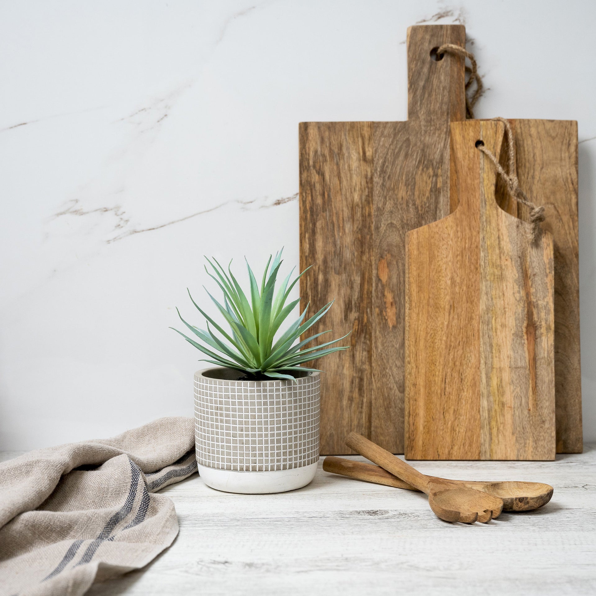Artificial succulent plant in check patterned concrete pot 8