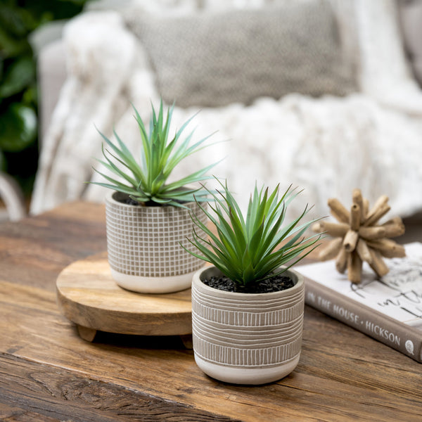 Artificial succulent plant in check patterned concrete pot 8