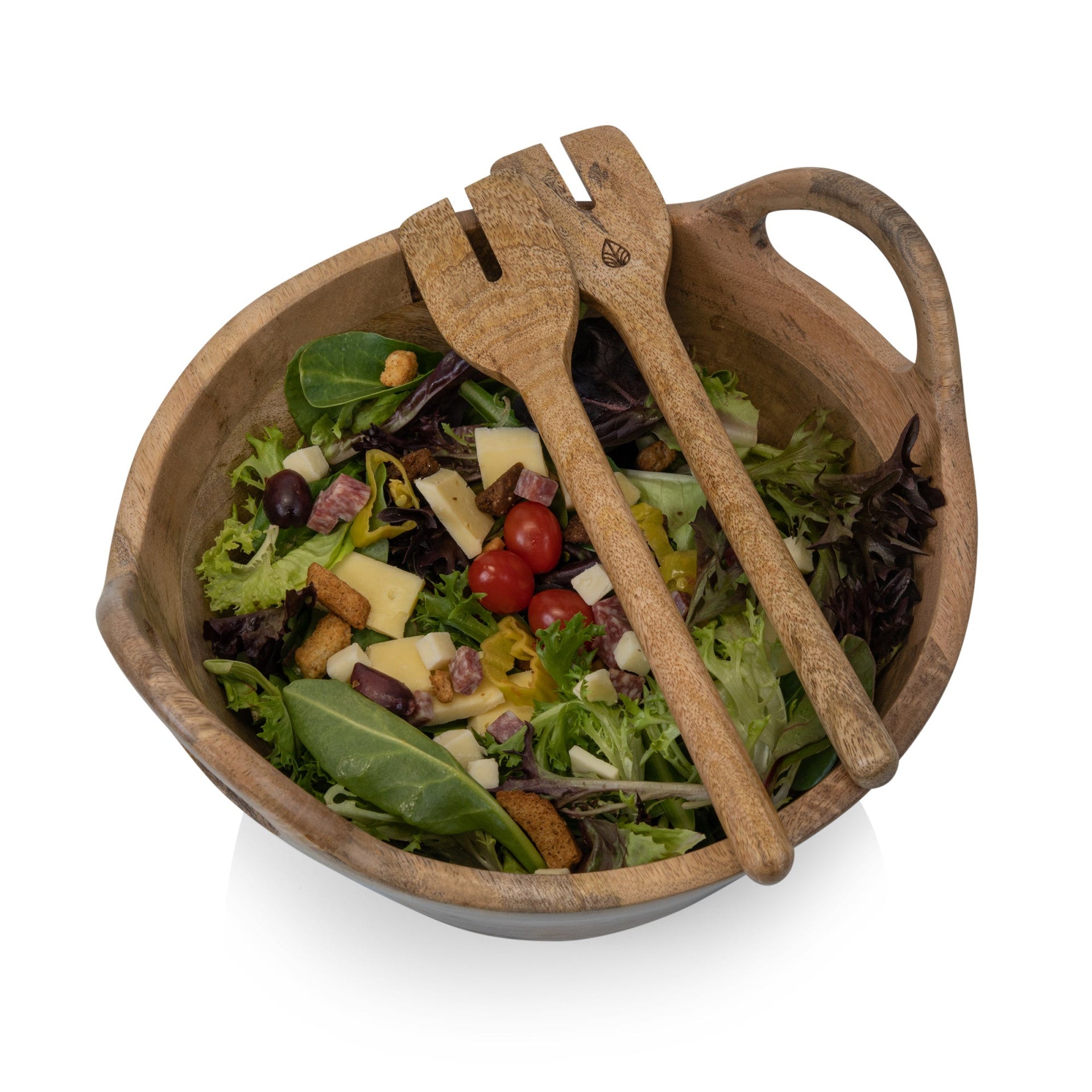 Wooden salad bowl with salad and wooden utensils on a white background
