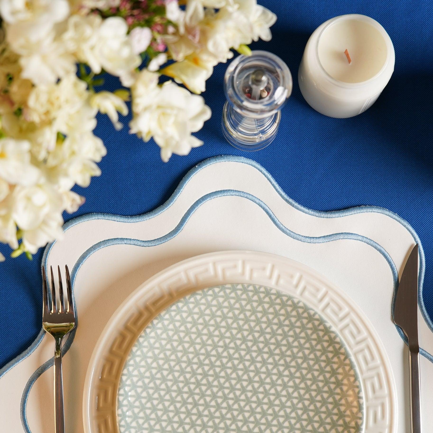SPRING TABLE DECOR – HAVEN WHITE WAVY EDGE BLUE TRIM FAUX LEATHER PLACEMAT