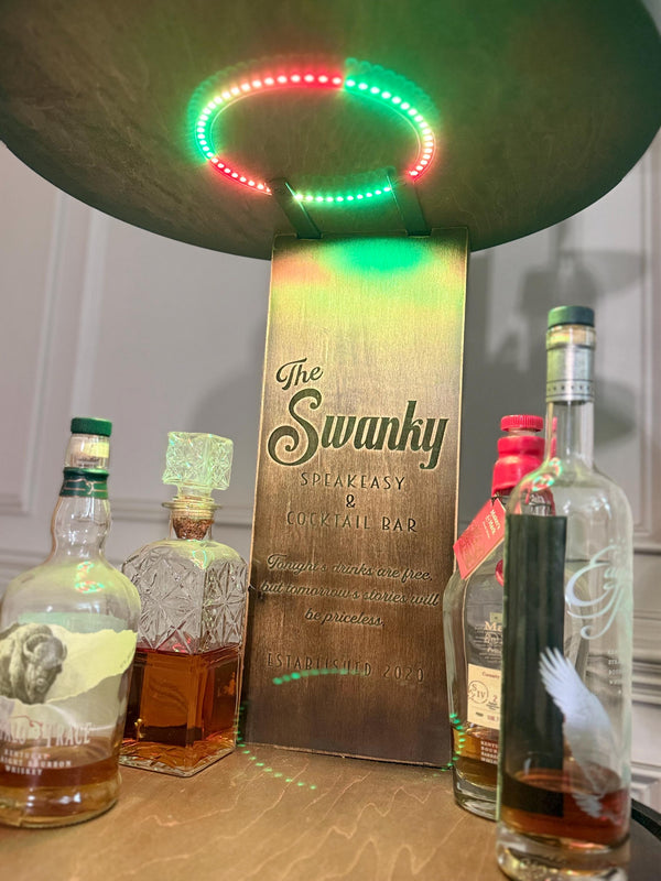 Motorized Pop Up Bourbon Barrel Cabinet.  Remote control & LED lighting.  Works with Alexa and Google Home. Custom engraving available.