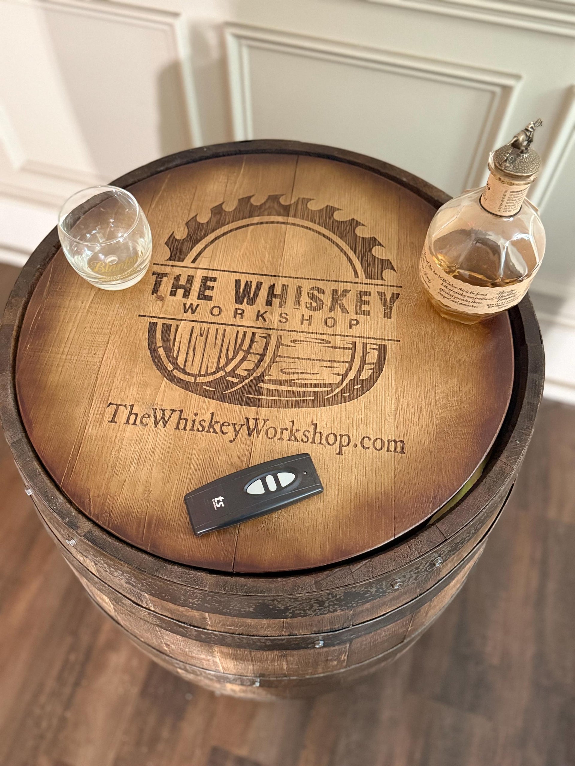 Motorized Pop Up Bourbon Barrel Cabinet.  Remote control & LED lighting.  Works with Alexa and Google Home. Custom engraving available.