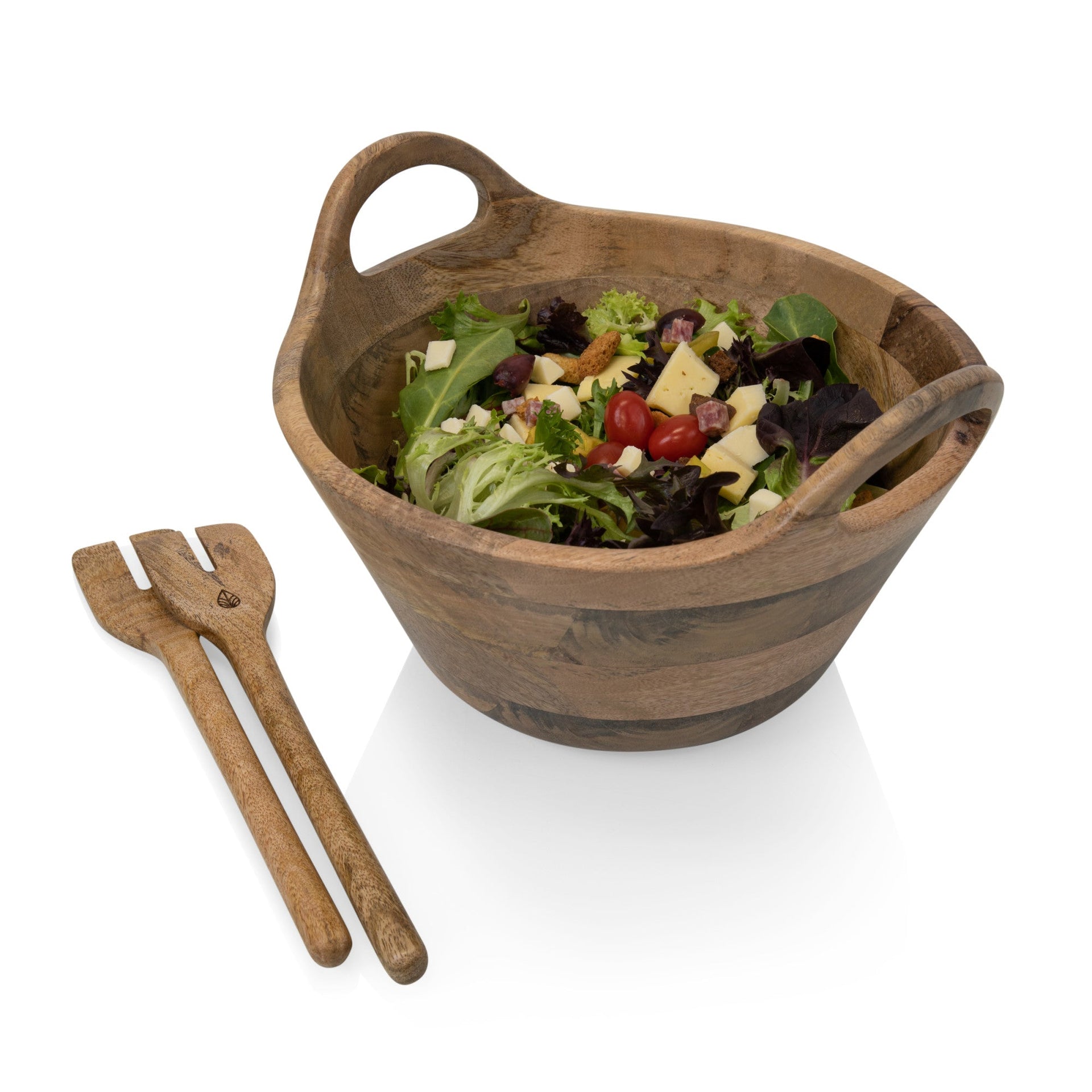 Wooden salad bowl with salad and wooden utensils on a white background