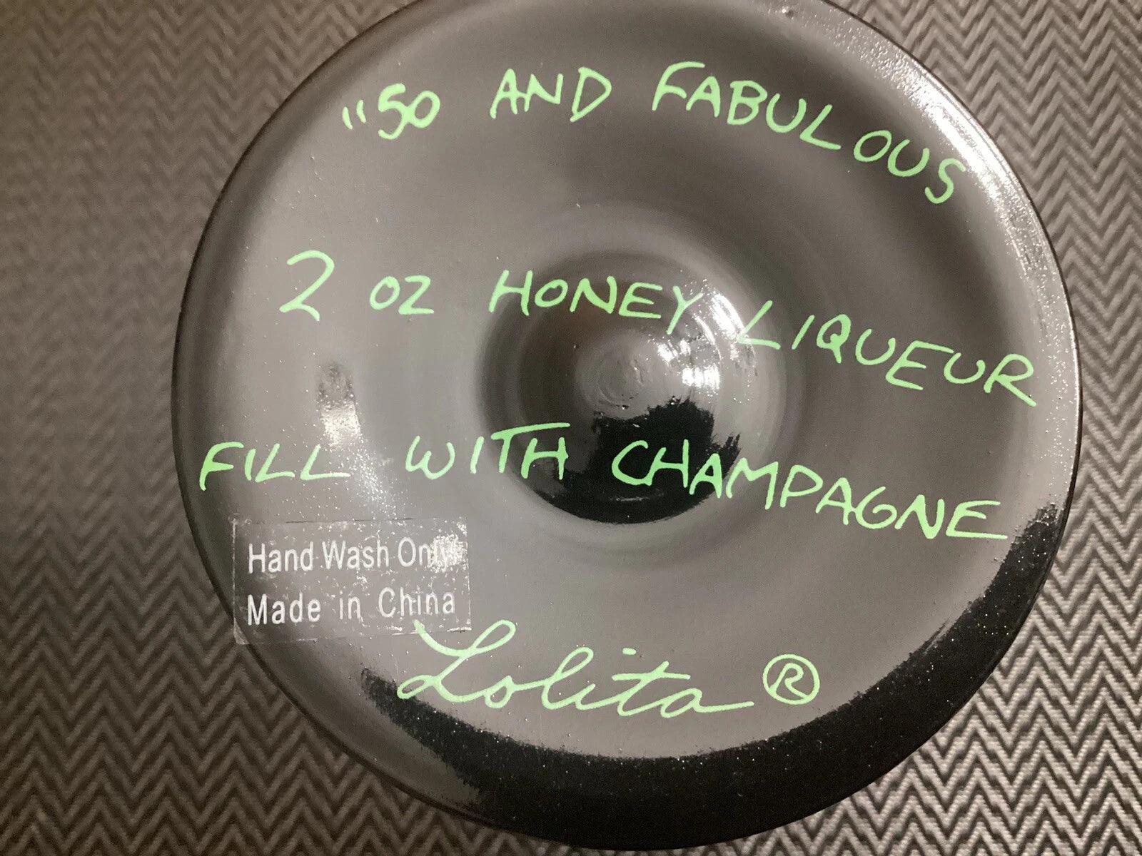 Lolita bottle cap with green text on a textured background