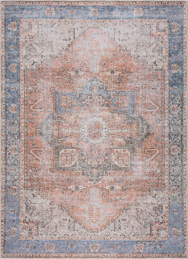 Decorative rug with intricate pattern in shades of blue, pink, and beige.