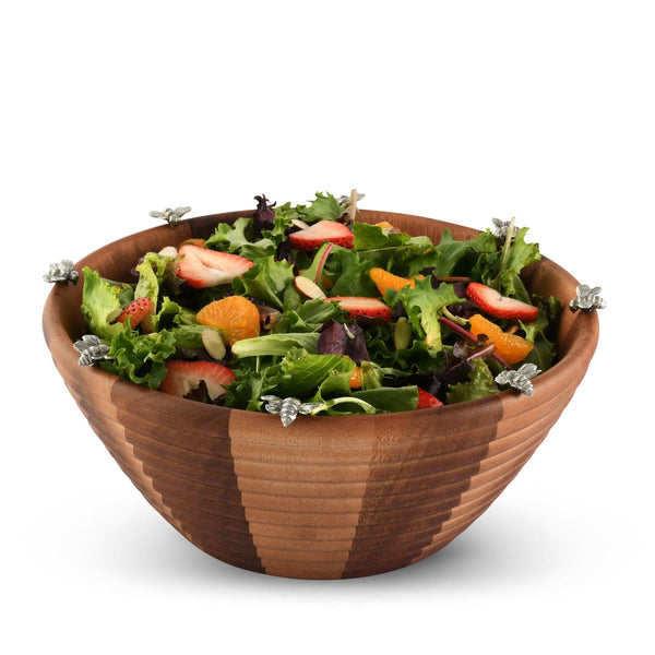 Wooden salad bowl with a colorful salad on a white background