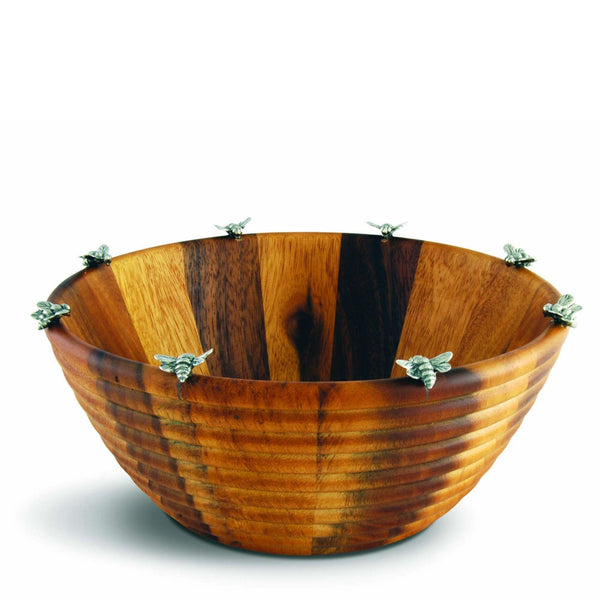 Wooden bowl with a striped pattern and decorative elements on a white background