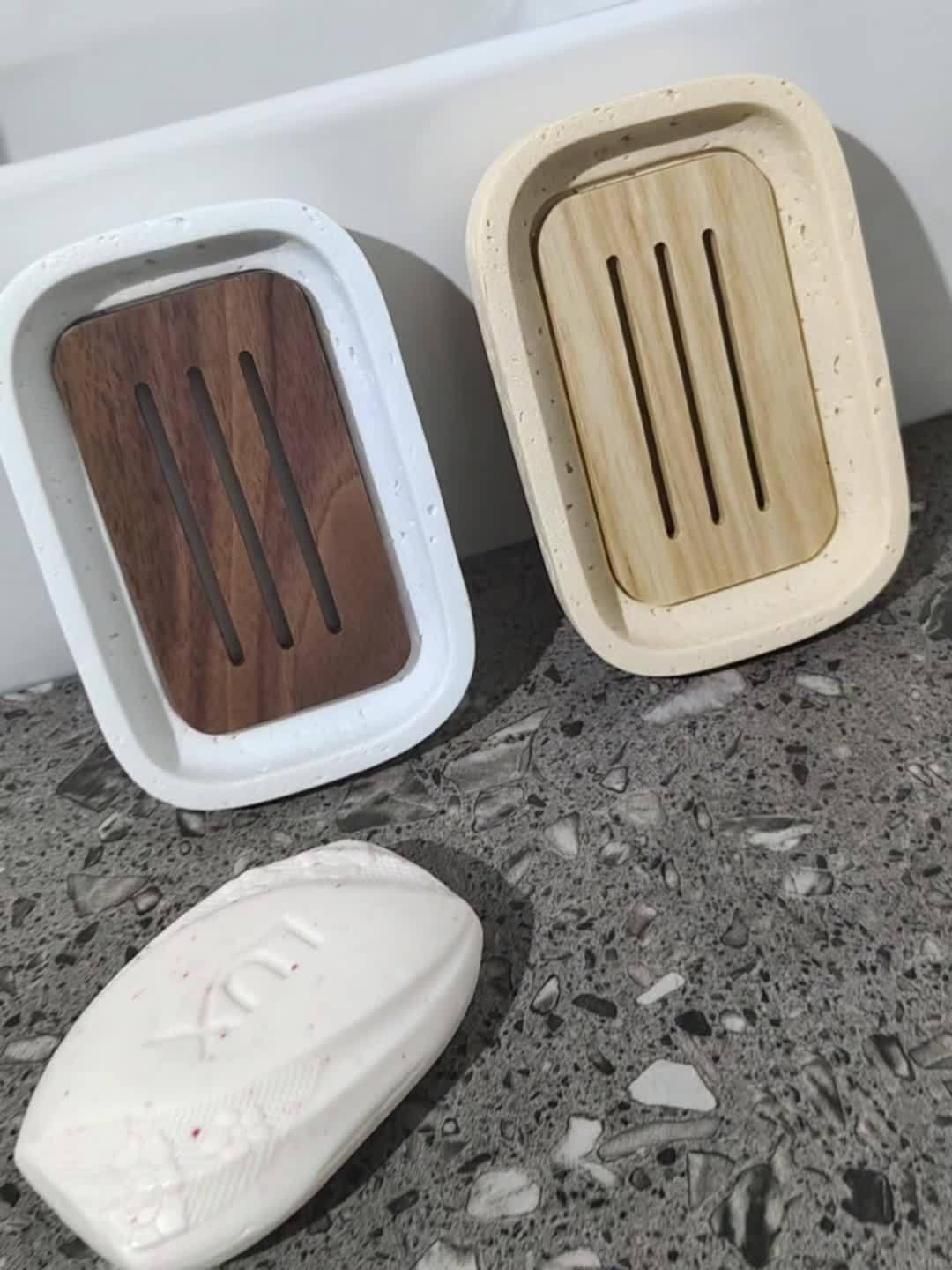 Wabi - sabi style sand - stone resin soap dish. The off - white sand - stone textured dish body is paired with a partition polished from imported North American walnut, presenting a simple and natural look. Sized approximatel