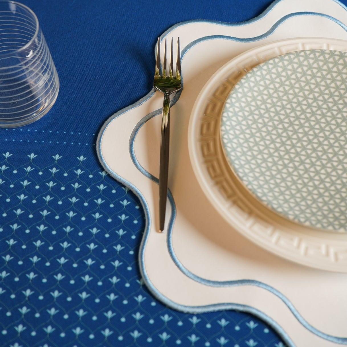 SPRING TABLE DECOR – HAVEN WHITE WAVY EDGE BLUE TRIM FAUX LEATHER PLACEMAT