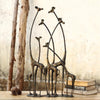 Towering Giraffe Herd Sculpture